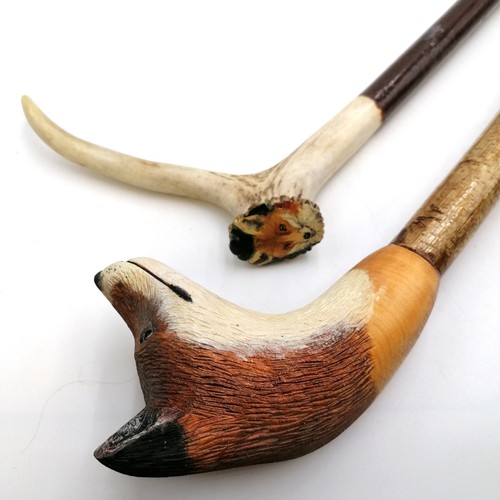 9 - 3 walking sticks - 1 with large hand carved fox head handle, 1 with antler handle with fox painted o... 