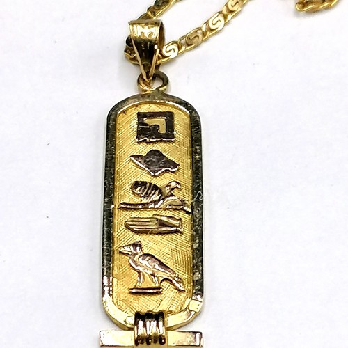 201 - High carat gold egyptian hieroglyphic pendant on 18ct gold 20