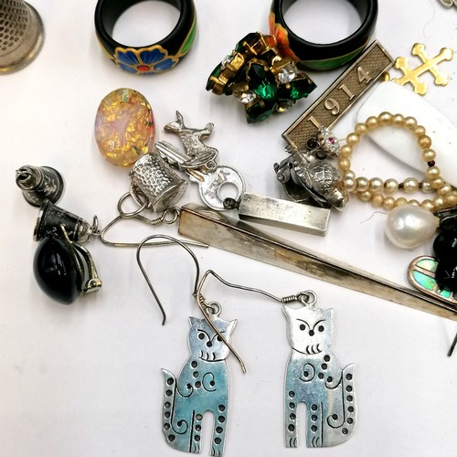 215 - Qty of costume jewellery - mostly earrings t/w silver cat earrings & poker dice set etc