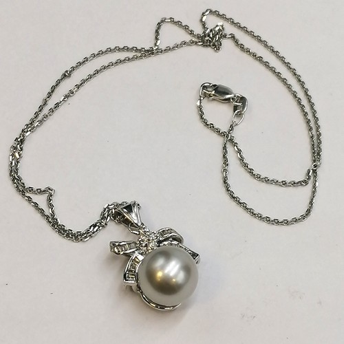 231 - 18ct unmarked white gold diamond and pearl set pendant on 14ct marked 18