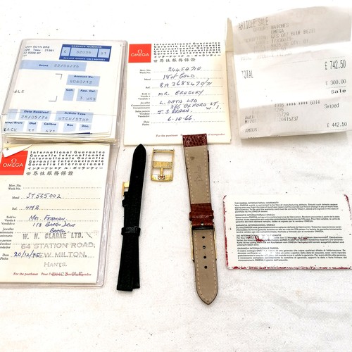 355 - Omega 2 straps with buckles, separate buckle, 2 booklets and warranty card & inside story of watch b... 