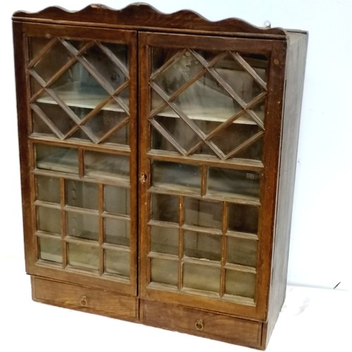 593 - c.1815 2 door glazed pine cabinet with original scumble finish with 2 small drawers & 2 adjustable s... 