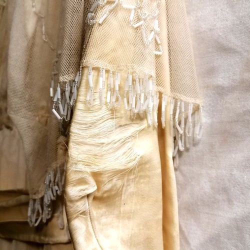 650 - Edwardian cream silk dress with overlaid beaded netting - some staining around neckline & small hole... 