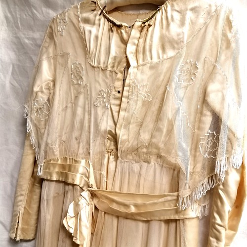 650 - Edwardian cream silk dress with overlaid beaded netting - some staining around neckline & small hole... 