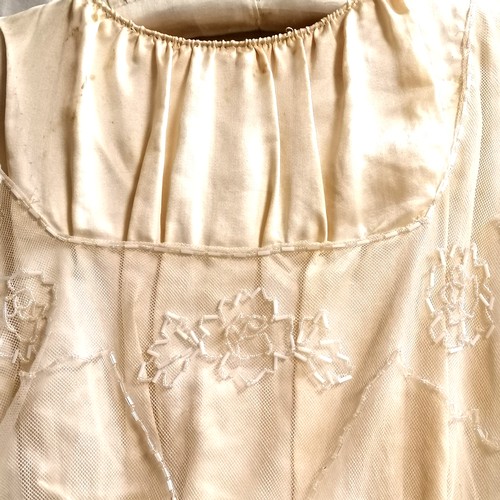 650 - Edwardian cream silk dress with overlaid beaded netting - some staining around neckline & small hole... 