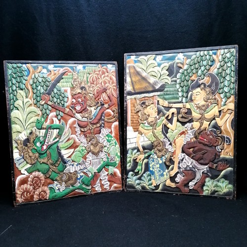 696 - Hindu pair of painted wood panels - largest 16