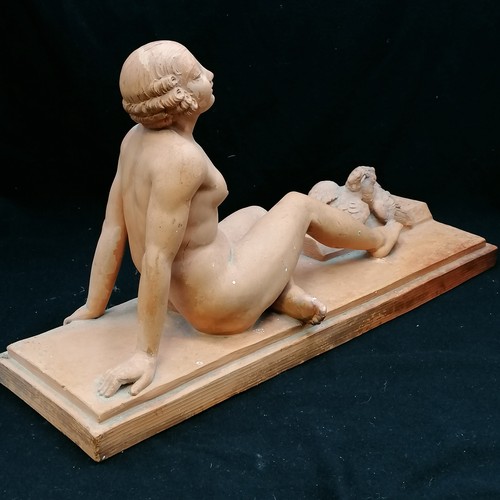 701 - Terracotta figure of a reclining lady signed J Montry, slight a/f broken wing on bird - 21