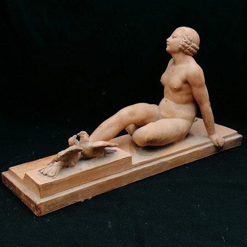 701 - Terracotta figure of a reclining lady signed J Montry, slight a/f broken wing on bird - 21