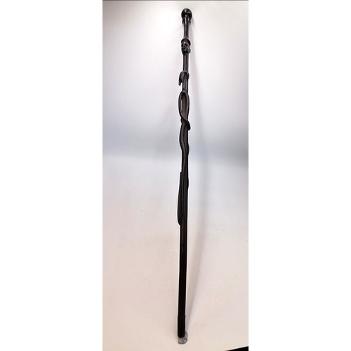 704 - Ebony hand carved tribal walking stick depicting snakes, lizard, bird etc - 36