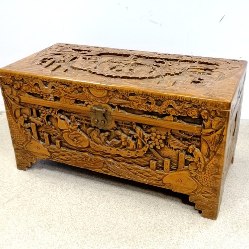 713 - Oriental carved camphor wood chest. In good condition. 29