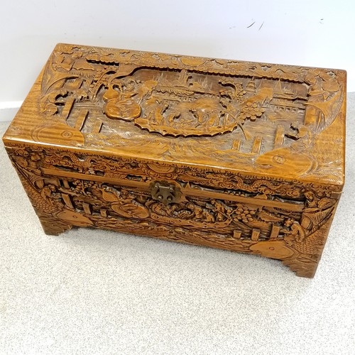 713 - Oriental carved camphor wood chest. In good condition. 29