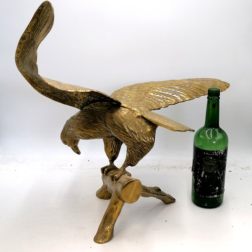 714 - Large brass eagle figure on a branch - wingspan 22