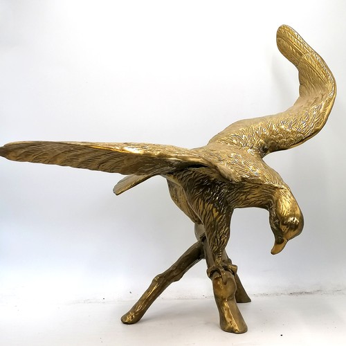 714 - Large brass eagle figure on a branch - wingspan 22