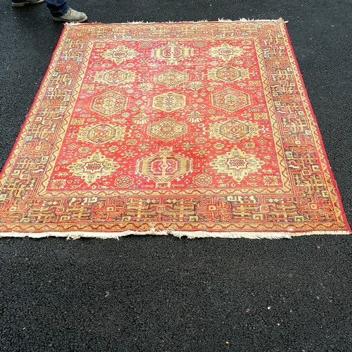 732 - Red grounded wool rug - 8' x 5'10