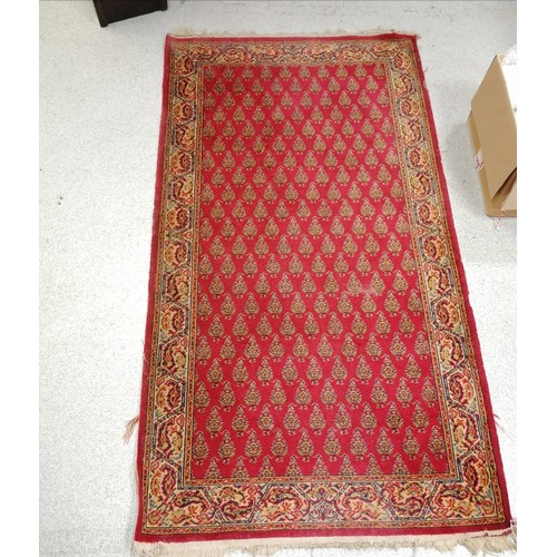 734 - Red grounded wool rug - 5'4 x 2'11