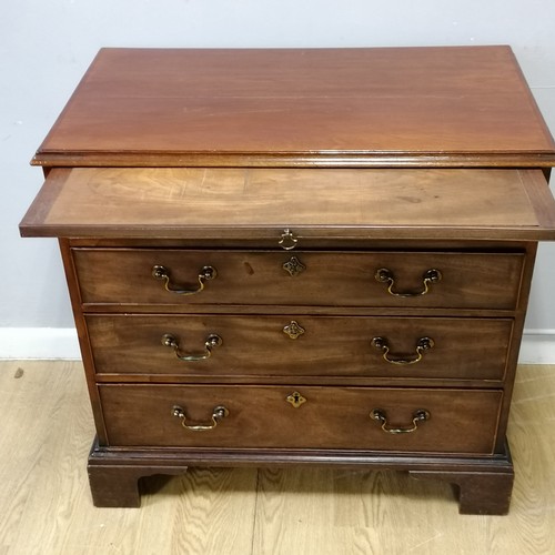 600A - Antique mahogany chest of drawers with brush slide. Crack to top and both sides