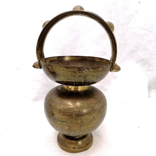 124 - Brass eastern mask t/w oriental brass handled vase (10