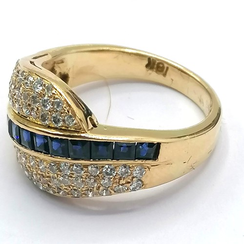 329 - 18ct ring set with diamonds and channel set sapphires - 7.7g total weight