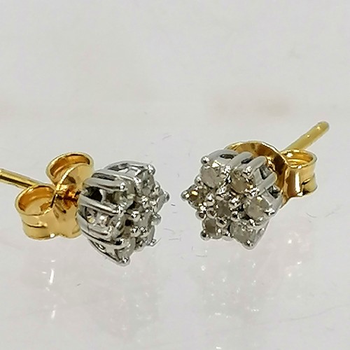 355 - 18ct gold pair of diamond cluster earrings