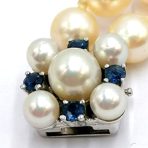 361 - Pearl 2-strand bracelet with a 14ct white gold clasp set with sapphires & pearls