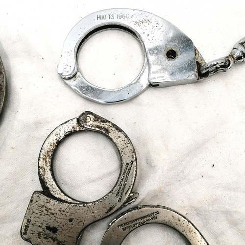 450 - Collection of antique + later handcuffs inc. Hiatts, a double, 4 pairs with keys