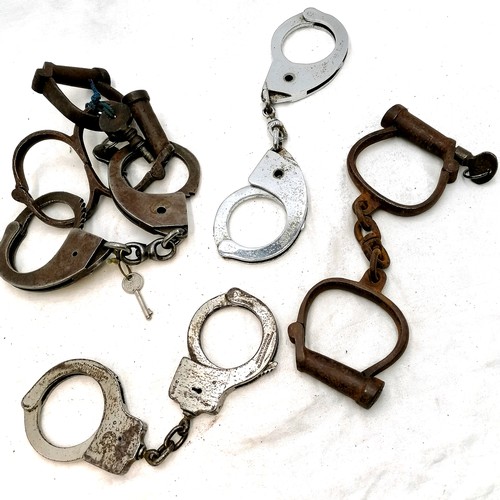 450 - Collection of antique + later handcuffs inc. Hiatts, a double, 4 pairs with keys