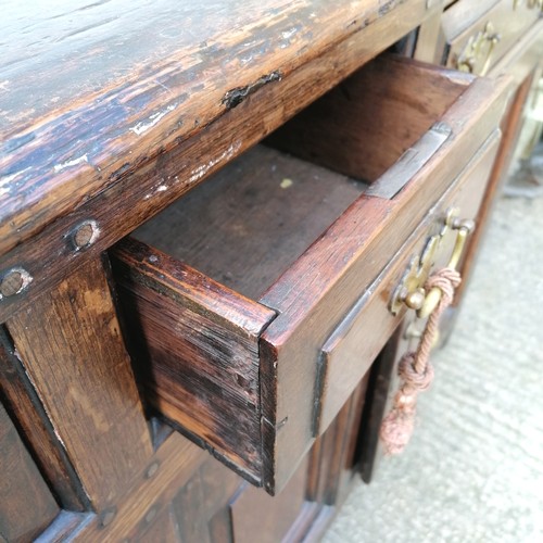 617 - 18th century oak low dresser comprising of 3 drawers over 2 cupboards with central panel - arched pa... 