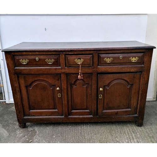 617 - 18th century oak low dresser comprising of 3 drawers over 2 cupboards with central panel - arched pa... 