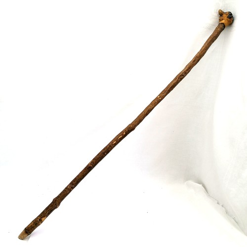 3 - Folk Art walking stick with a carved head handle of Hitler with painted eyes and hair. 94cm long