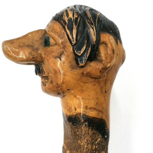 3 - Folk Art walking stick with a carved head handle of Hitler with painted eyes and hair. 94cm long