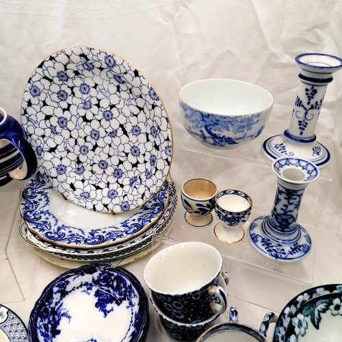 91 - Qty blue and white china tableware incl. candlesticks and teapot stand.