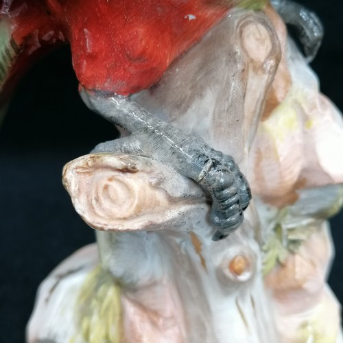 143 - Meissen parrot - height 21cm ~ restoration to one wing and  claw, chip to base / flowers