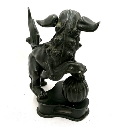 185 - Oriental bronze figure of a foo dog - 19.5cm high