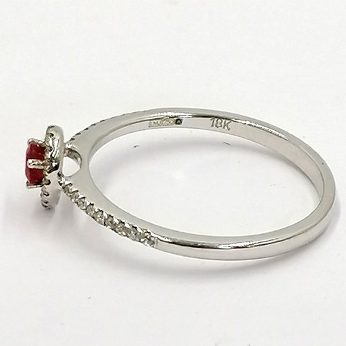 267 - 18ct white gold ruby & diamond (33) ring with a pear shaped head ~ size N