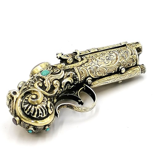 395 - Unmarked silver snuff box in the form of a double barrelled flintlock pistol, with profuse decoratio... 