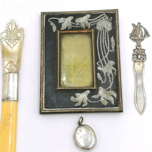 403 - Silver locket, silver bookmark, small Art Nouveau frame, treen bowl and paperknife.