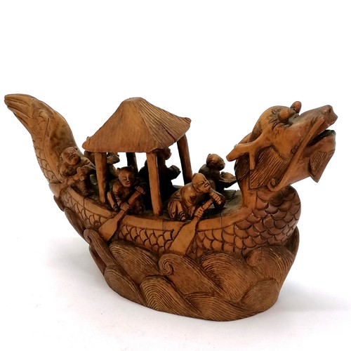 555 - Chinese carved model of a dragon boat with 6 oarsmen - 21cm x 11cm high ~ has some cracks