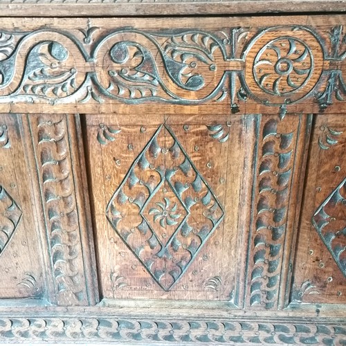 611 - Large antique elm reconstructed coffer with 4 panel front with carving & frieze decorated with carve... 