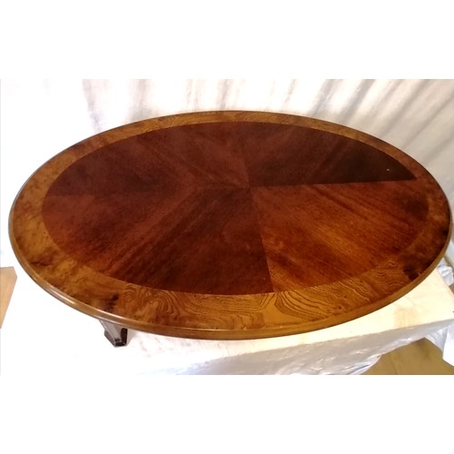 612 - Mahogany & walnut veneer oriental style oval coffee table - 112cm x 67cm x 42cm & has some marks to ... 