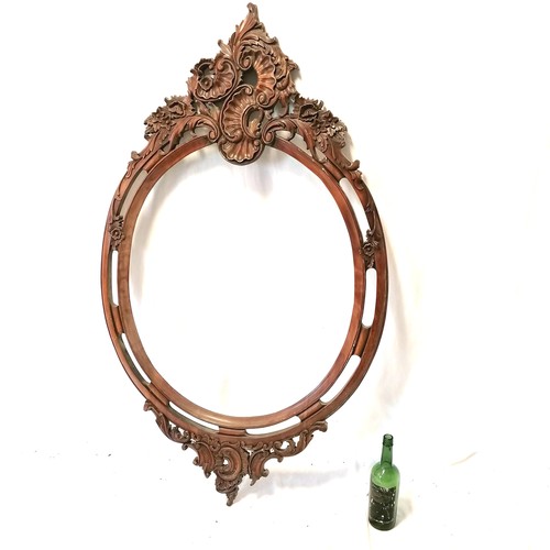 616 - Large ornate carved mahogany oval frame - 141cm x 84cm