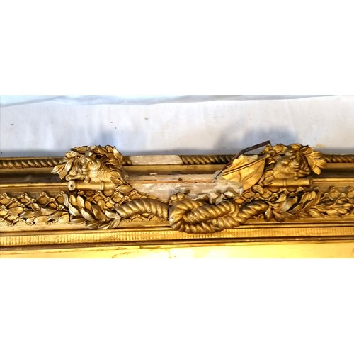 620 - Antique gilt framed mirror with nautical themed decoration (some losses, and some of the detached pi... 