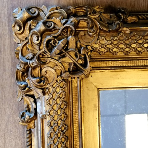 620 - Antique gilt framed mirror with nautical themed decoration (some losses, and some of the detached pi... 