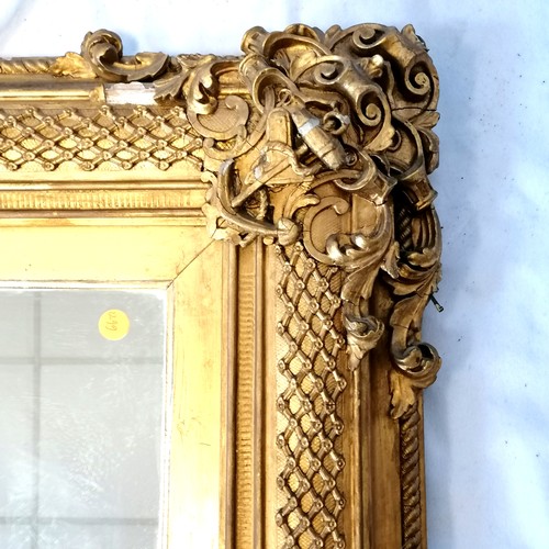 620 - Antique gilt framed mirror with nautical themed decoration (some losses, and some of the detached pi... 