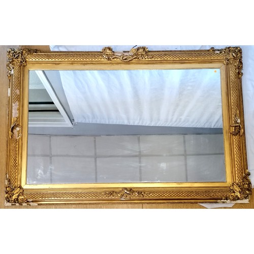 620 - Antique gilt framed mirror with nautical themed decoration (some losses, and some of the detached pi... 