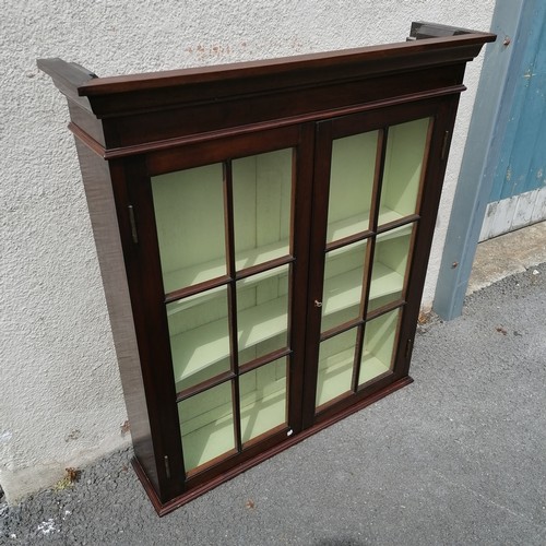 634 - Mahogany glazed wall cabinet. In good condition