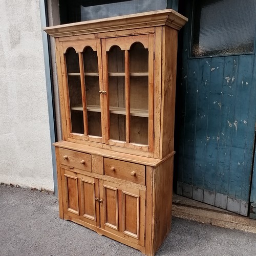 635 - Antique pine dresser with glazed cupboard top and 2 door cupboard and drawers to base. In good condi... 