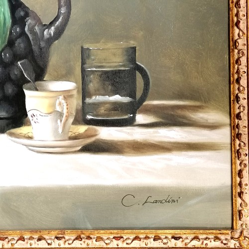 718 - Oil on canvas of a still life (63cm x 73cm) signed C Landini