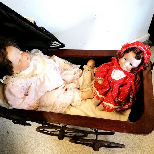 729 - Reproduction dolls pram (86cm high 64cm long) inc sleeping doll + 2 others + a dolls parasol