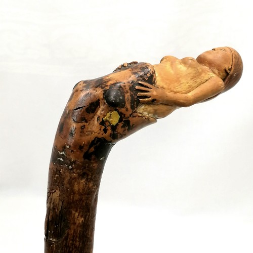 736 - Folk art carved walking stick with a snake swallowing a lady who doesn't look terribly happy(!!) han... 