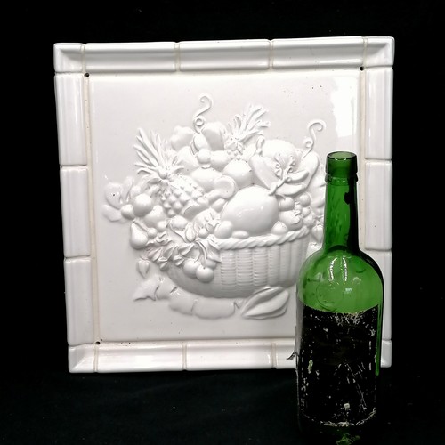 746 - Contemporary ceramic panel with relief decoration of basket of fruit  36cm square In good condition